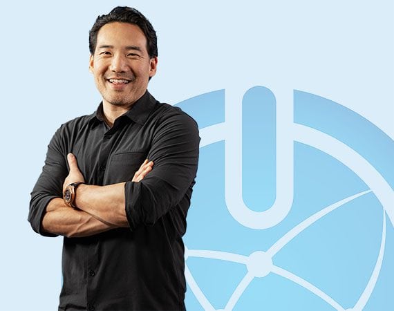 Steve in front of blue background with M Global's icon logo